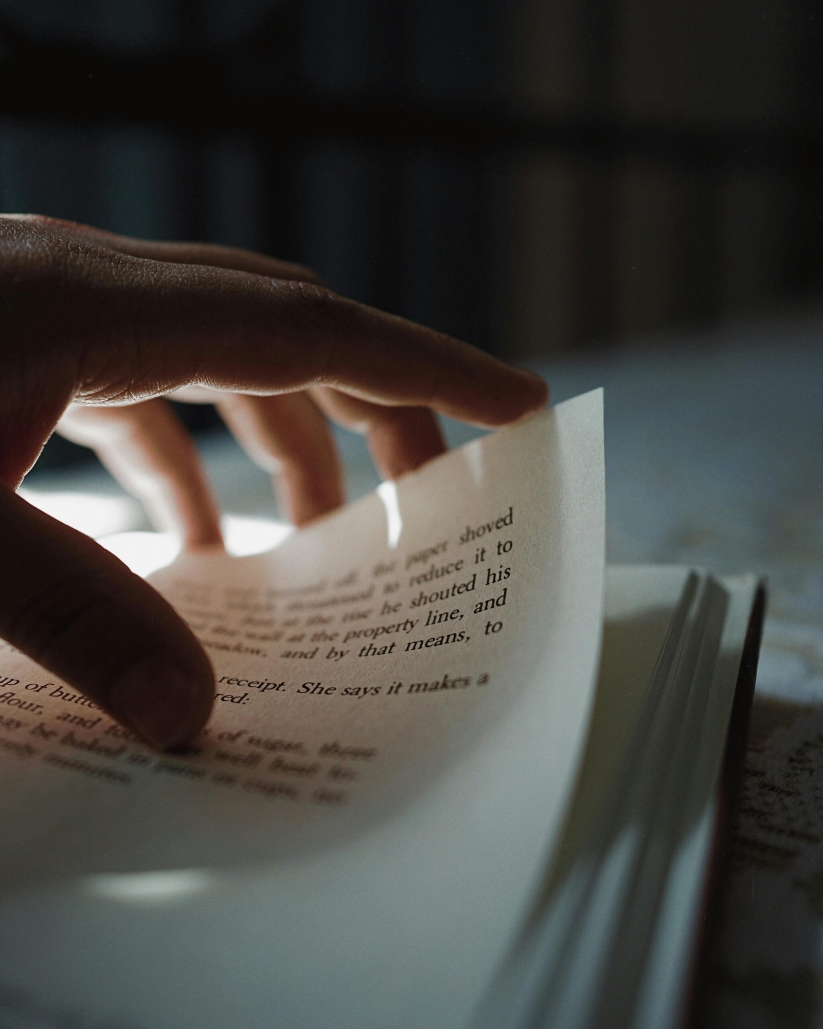 Hand turning a book page