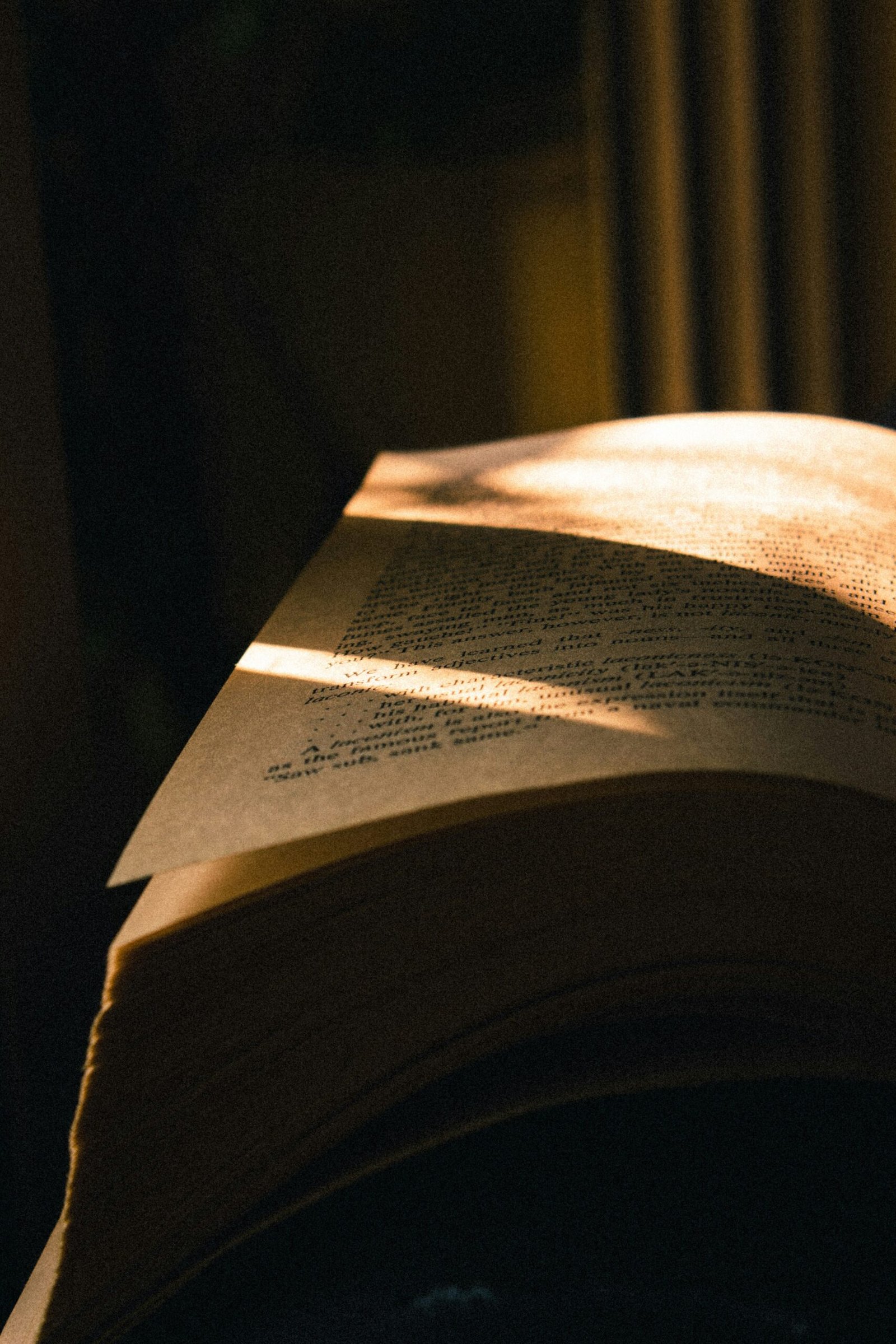 Book pages with golden light